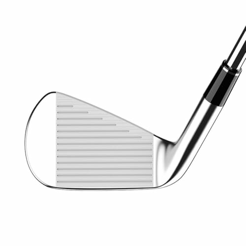 Closeup of a golf iron club head.